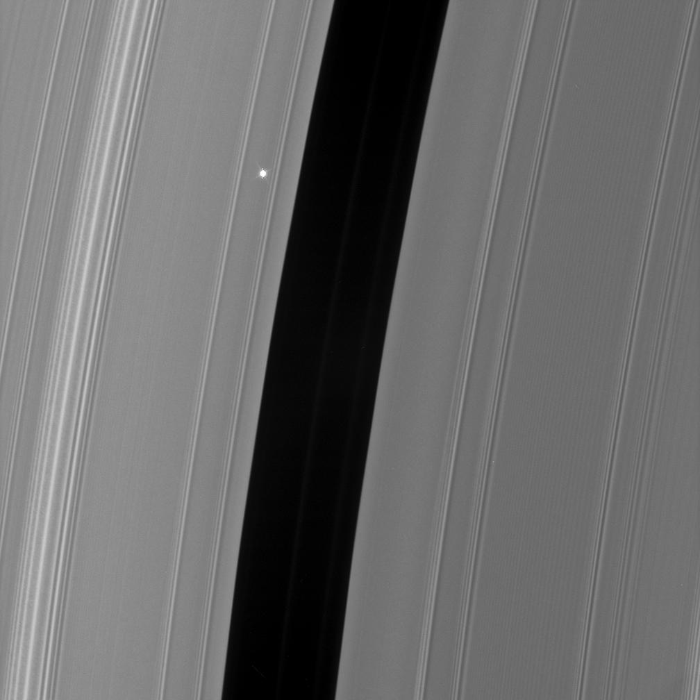 As Cassini watches the rings pass in front of the bright red giant star Aldebaran, the star light fluctuates, providing information about the concentrations of ring particles within the various radial features in the rings