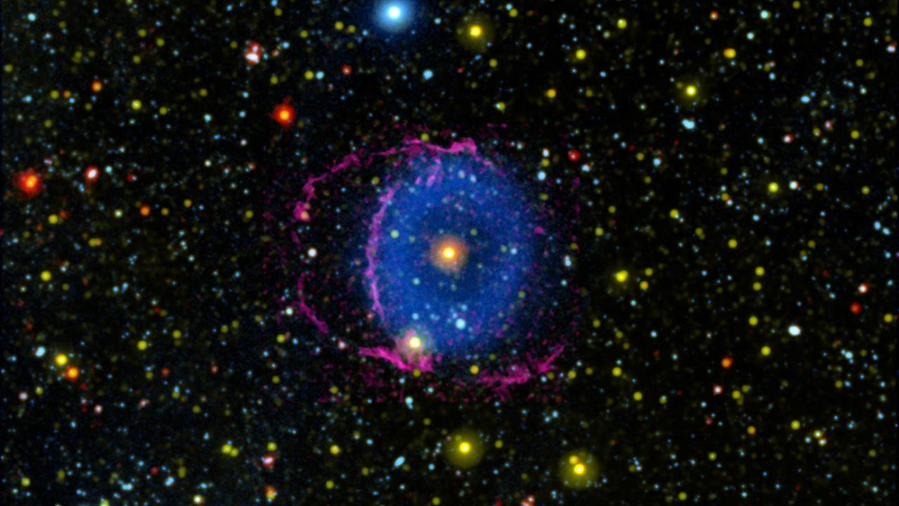 The Blue Ring Nebula consists of two expanding cones of gas ejected into space by a stellar merger. As the gas cools, it forms hydrogen molecules that collide with particles in interstellar space, causing them to radiate far-ultraviolet light.