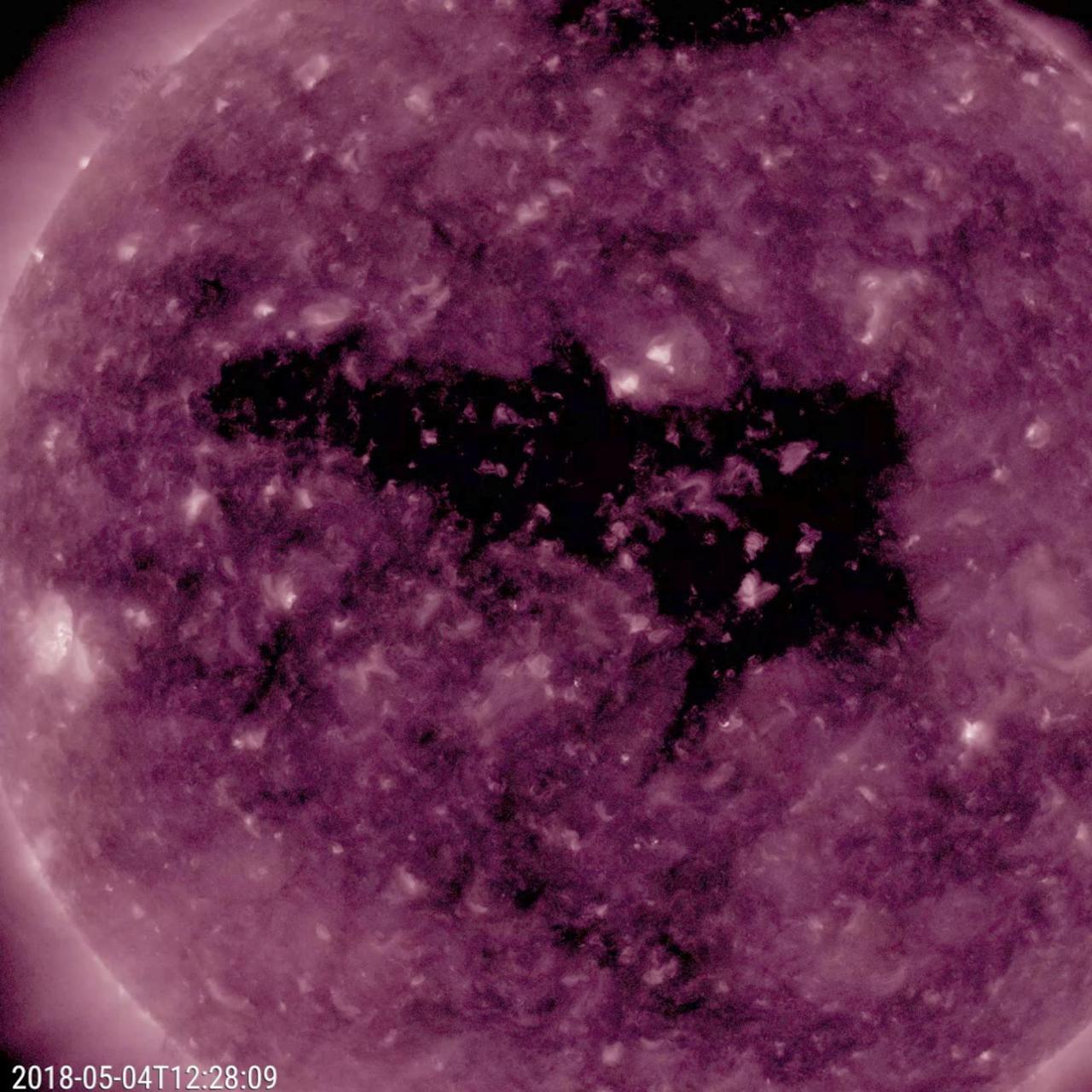 NASA's Solar Dynamics Observatory observed an extensive equatorial, dark coronal hole extending about halfway across the solar disk on May 2-4, 2018.