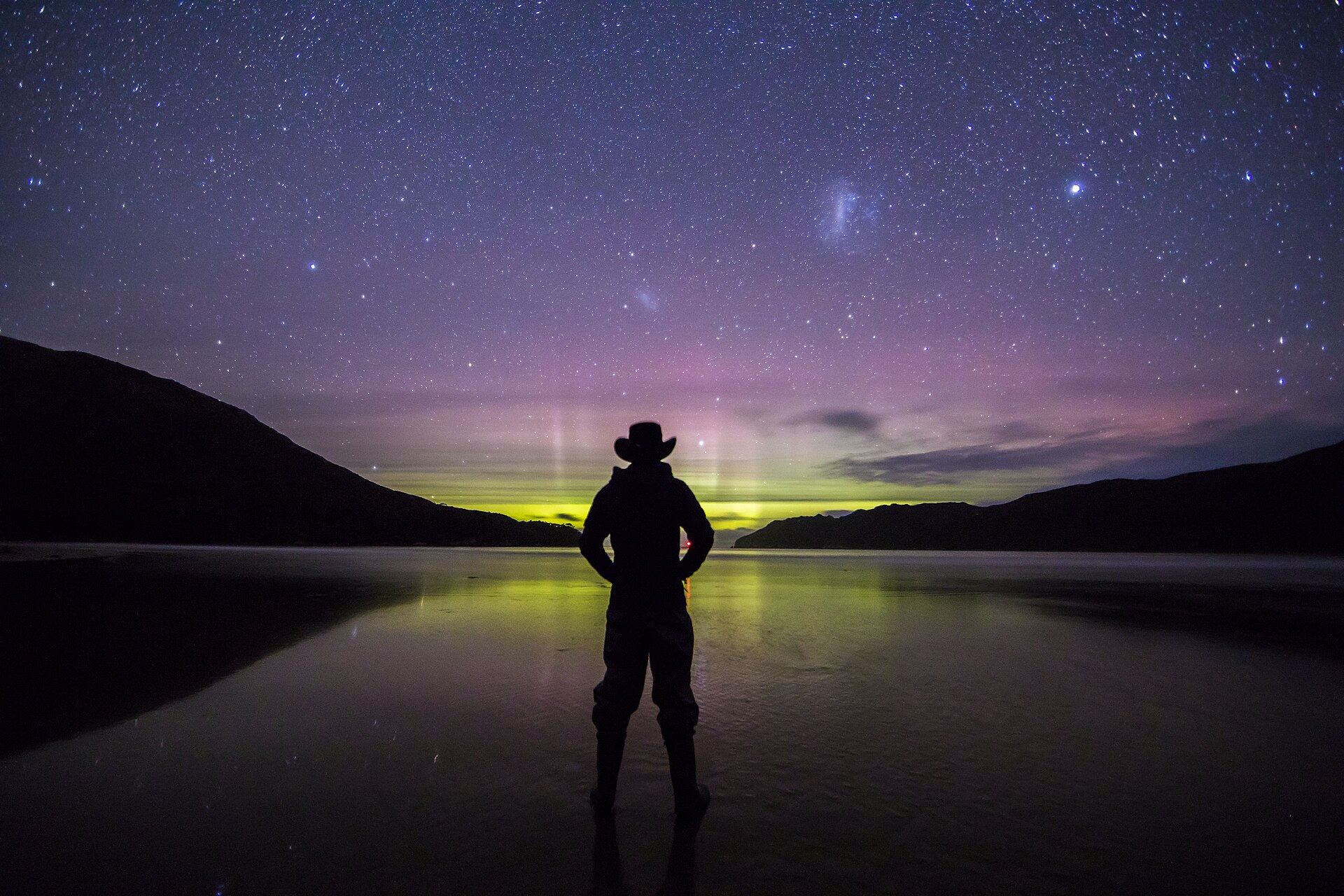 Aurora Australis glows along the horizon from New Harbour Beach in Tasmania. Southwest National park