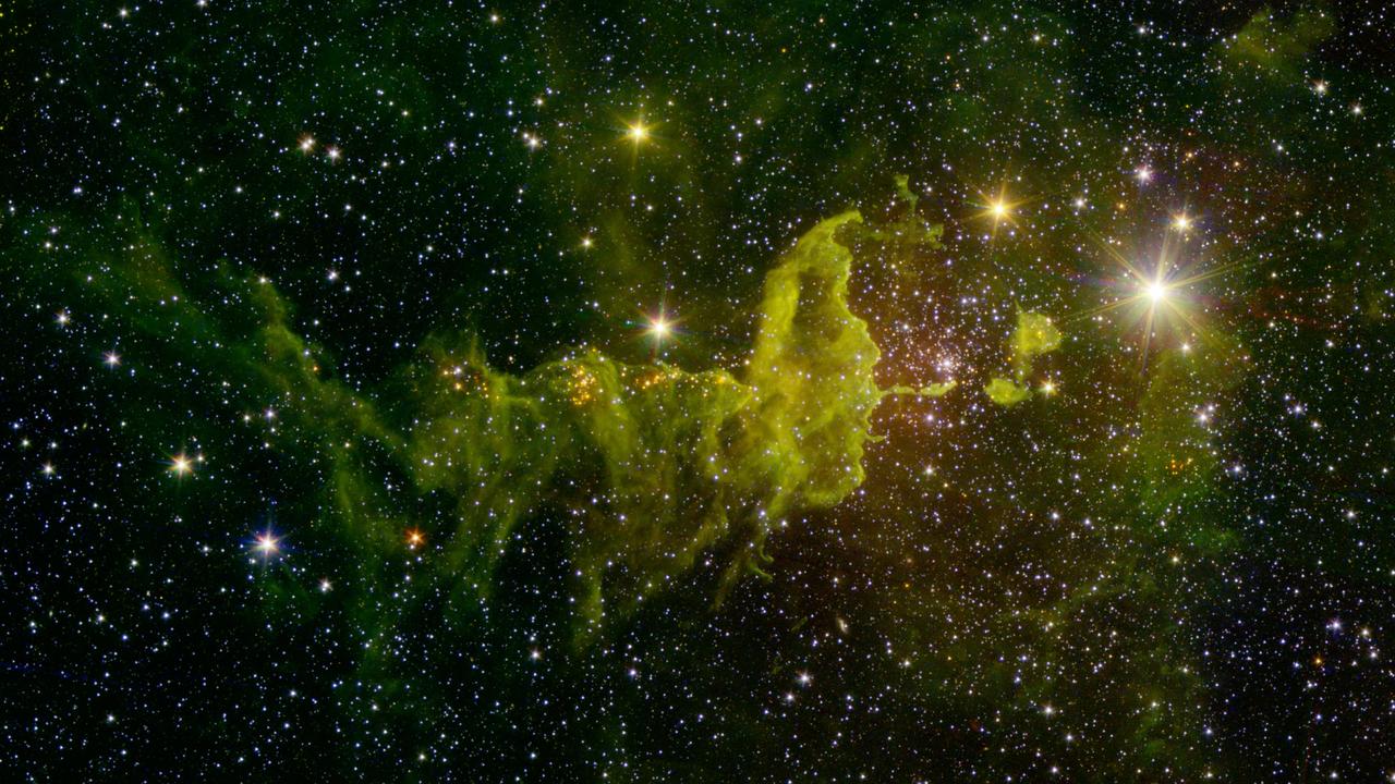The spider part of The Spider and the Fly nebulae, IC 417 abounds in star formation, as seen in this infrared image from NASA Spitzer Space Telescope and the Two Micron All Sky Survey 2MASS.